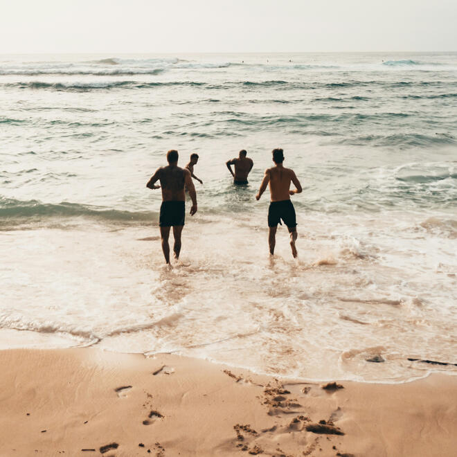 Wishing you new adventures ahead — Vacay Fuel Family running toward waves on a beach at a distance, symbolizing hope and new beginnings